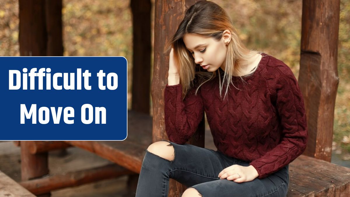 Beautiful young woman in a stylish knitted sweater sits on a wooden bench in nature.